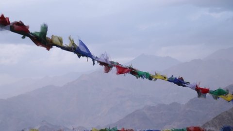 prayer flags at the terrace of a monastery in ladakh