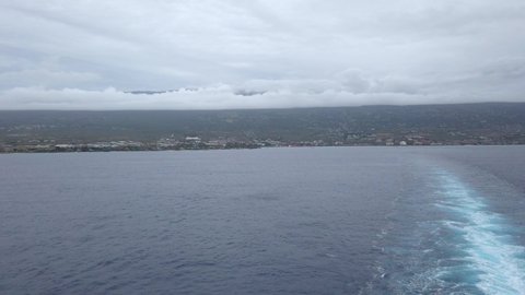 Seascape from cruise ship in Kailua-Kona on the Big Island of Hawaii. The west coast of Hawaii is known as the “Kona Side” and Kailua-Kona is the lively center of it all.