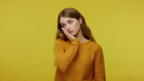 My fault. Depressed frustrated girl in casual outfit slapping hand on forehead gesturing facepalm, blaming herself for mistake, feeling sorrow regret shame. studio shot isolated on yellow background