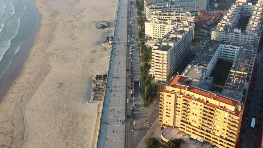 Aerial view of cars driving along seaside road in Portugal
