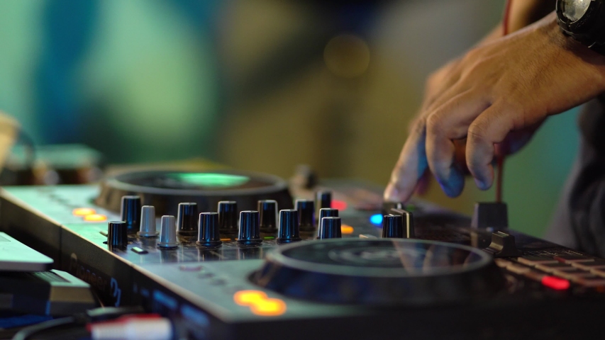 DJ playing music in club house Royalty-Free Stock Footage #1045348942