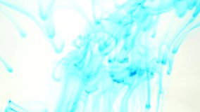 Colored ink dripping in water abstract background