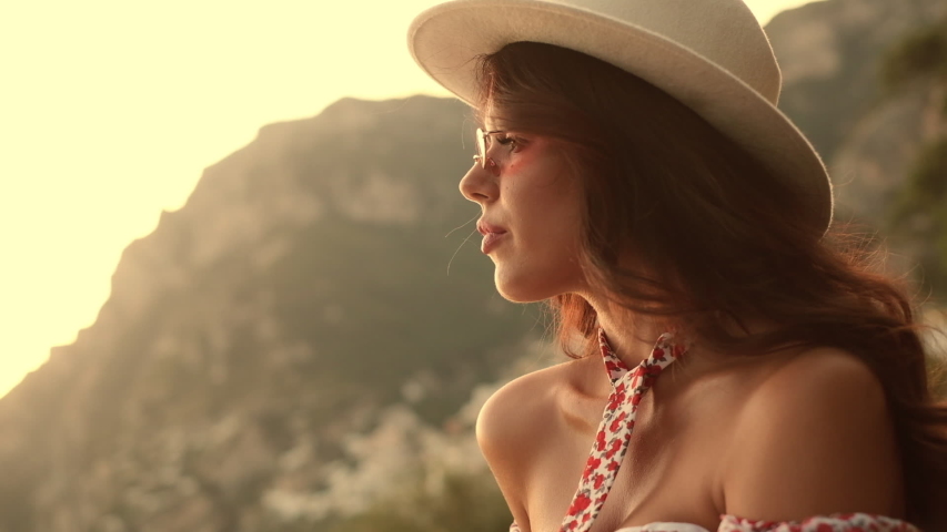 Pretty Brunette In Sunglasses And Hat. Girl Enjoys The Scenery Of Italy. Positano.