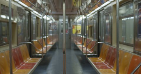 Empty Subway Train Car INTERIOR.
Train in motion. Background texture for overlay. Wide Shot Full Car. 