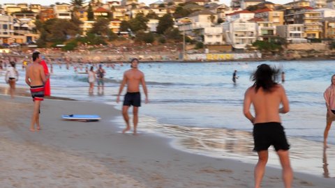 Lads Beach Soccer : Bondi Beach, ,other people males and female around and in the background: Bondi Beach : Bondi Beach, Sydney Australia - March 2018 