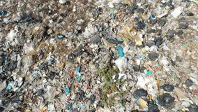Plastic pollution environmental problem. A landfill in Southeast Asia filled with trash which is not recycled. Aerial drone video