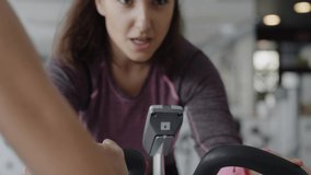 Handheld view of determined woman exercising in a gym.  Shot with RED helium camera in 8K