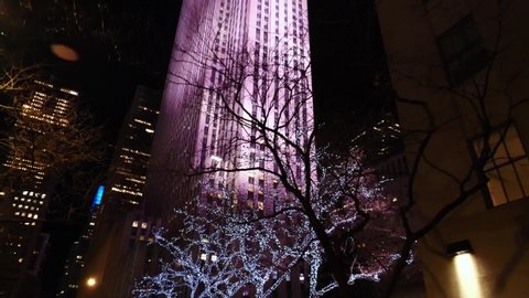 NEW YORK CITY, USA - January 15, 2020: New York City Manhattan street view at night near Rockefeller center during Christmas. 4k slow motion. NYC is a modern urban city, famous USA tourism destination