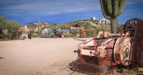 Wickenburg, AZ, US -1-12-20:
 A Ghost Town in the middle of the desert used to be a gold mine during the gold rush. Mining equipment, cars, and buildings remaining in Vulture City.