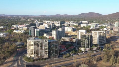CANBERRA, AUSTRALIA – JANUARY 26, 2020: Aerial view of Canberra City, capital of Australia, travelling toward the Ovolo Nishi, NewActon South Building and BreakFree Capital Tower on a sunny afternoon 