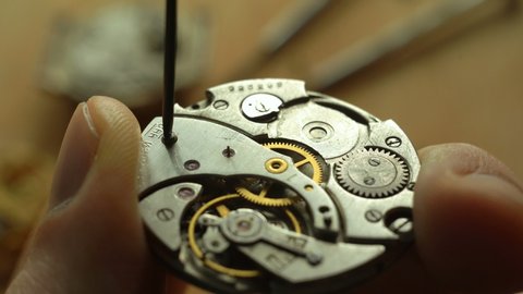 The master looses a screw in a mechanical watches Video de stock