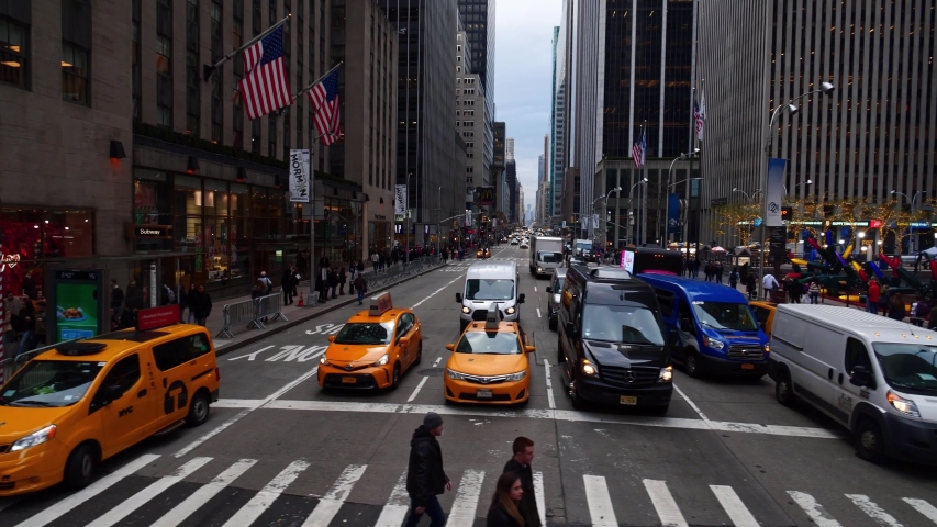NEW YORK CITY, USA - Jan 15, 2020: Row of modern skyscrapers in Manhattan New York City street. Drone shot 4k slow motion. NYC business offices, apartments  shops. 