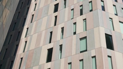 wall of a tall office building, bottom view. beige wall of a business center in sunny weather – Video có sẵn