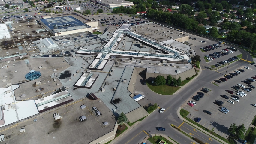 Ascending Aerial Over Shopping Mall Plaza With Parking Lots