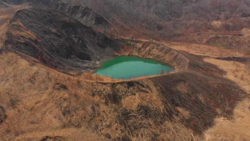 flying over vivid turquoise crater lake in hokkaido