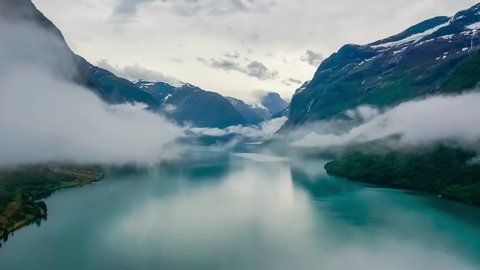 Beautiful Nature Norway natural landscape lovatnet lake flying over the clouds.