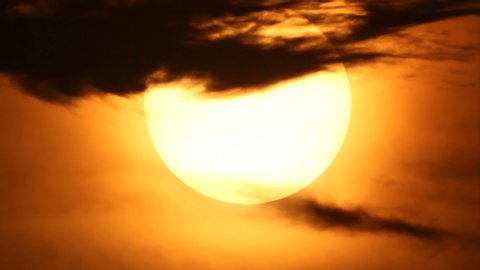 Rising big white disk sun in hot atmosphere of summer season