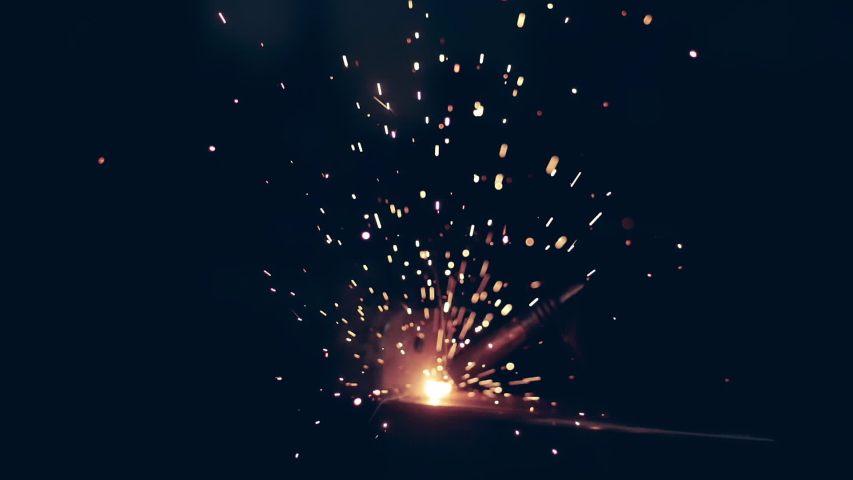 Blurred sparks and light caused by metal welding | Shutterstock HD Video #1045542949