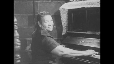 CIRCA 1968 - Jazz pianist Billie Pierce demonstrates how she would quickly switch from ragtime to playing hymns when her religious father was around.