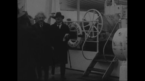 CIRCA 1920s - Albert Einstein is seen aboard a ship, and is met by an enthusiastic crowd when he docks.