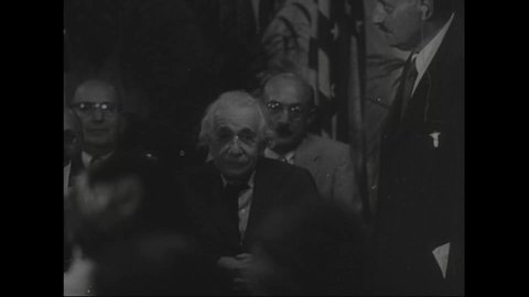 CIRCA 1950s - Some of Albert Einstein's accomplishments are listed at an American ceremony honoring him.