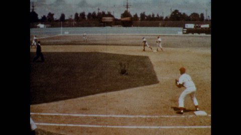 1970s: Shortstop throws the ball to first base. First baseman throws wide to third with runners on all bases. Ball goes into the stands and becomes dead. Umpire awards two bases to each runner.