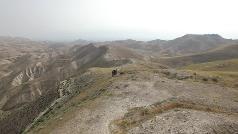 Aerial of hikers walking on Roman Road remains at Wadi Qelt. DJI-0176-05