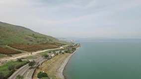 Descending aerial view of beach at the west shore of Sea of Galilee. DJI-0158-05