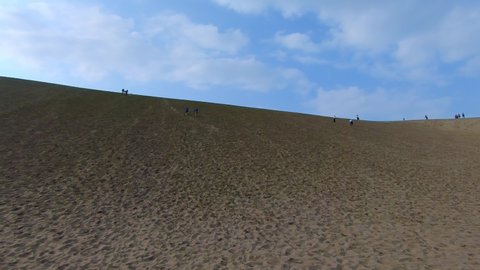 Tourists exploring sand wonders in the desert, Tottori Sand Dunes Japan