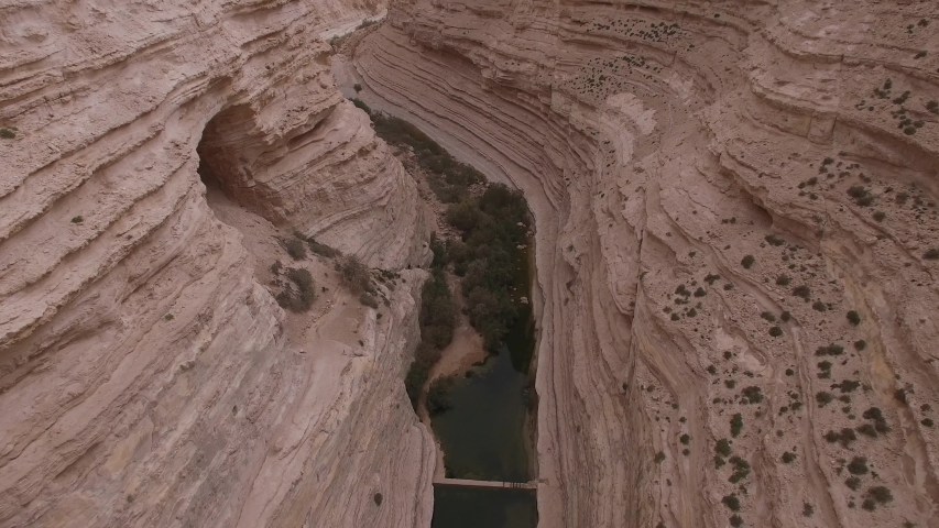Aerial of caves and river at Ein Avdat canyon. Negev Desert. Israel. 