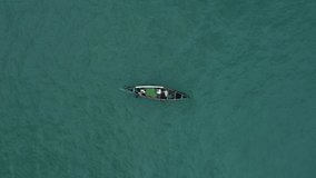Fishermen in the sea- aerial shot of lonely fishermen out in the sea