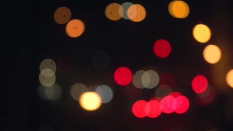 Bokeh of cars and traffic lights at night. Bokeh of City Night Traffic. Round colorful bokeh shine from car lights in traffic jam on city street. 