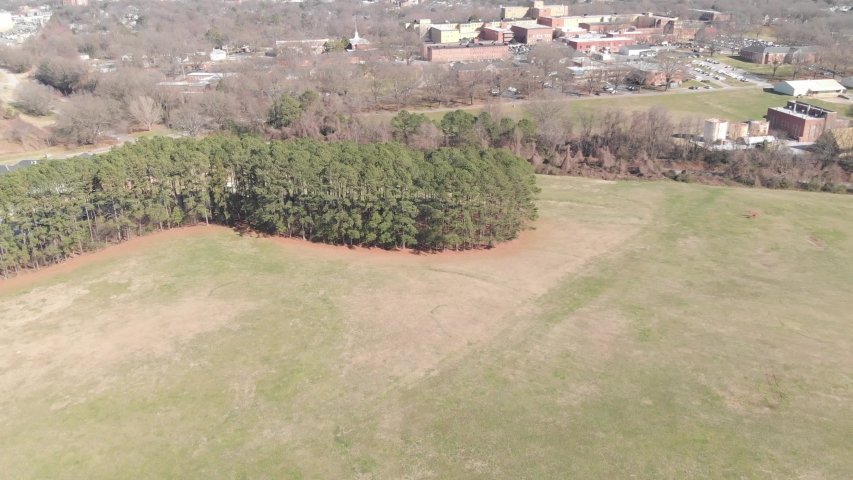 Raleigh North Carolina 4k Aerial Footage of a park nearby downtown skyline with trees, greenery, and buildings