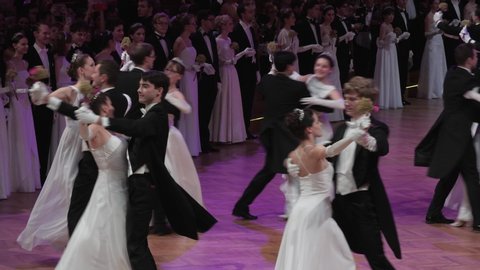 VIENNA AUSTRIA JAN 18 2018 opening ceremony of a traditional Viennese waltzing ball prom dance at the Hofburg Palace close up couples of Waltz dance formation dancing to classical Austrian waltz music