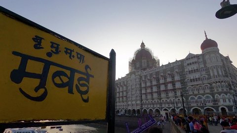 Mumbai, Maharashtra, India - Jan 27, 2020 : Real time still footage of the Placard / Sign board of Mumbai outside Gateway of India and The Taj Mahal Palace Hotel