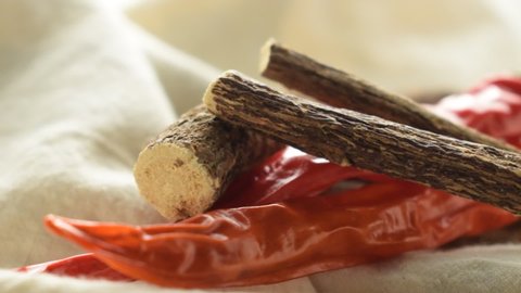 Dried sticks of liquorice root and chili pepper