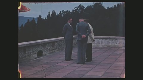 CIRCA 1940s - Color, Hitler talks to Himmler and others on his terrace at his Berchtesgaden retreat, 1940s