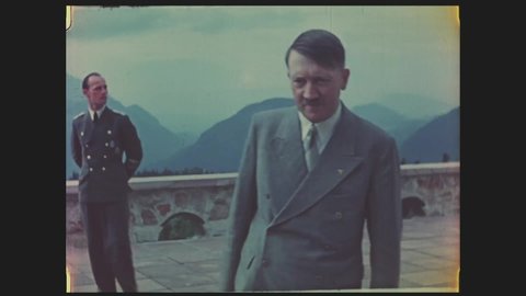 CIRCA 1940s - Color, Hitler and others on a terrace overlooking the mountains at his Berchtesgaden retreat, 1940s