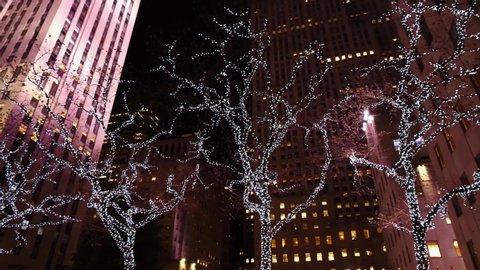 NEW YORK CITY, USA - January 15, 2020: 4k slow motion. Low angle drone view of New York City Manhattan street view at night near Rockefeller center during Christmas. NYC is modern urban business city