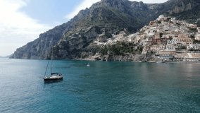 Shooting from the sea of Amalfi Coast, Italy. Beautiful view of the Tyrrhenian sea, mountain slopes and colourful houses. 4K video.