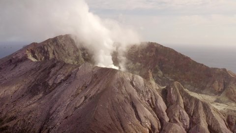 Aerial of billowing smoke coming from White Island, an active volcano in New Zealand