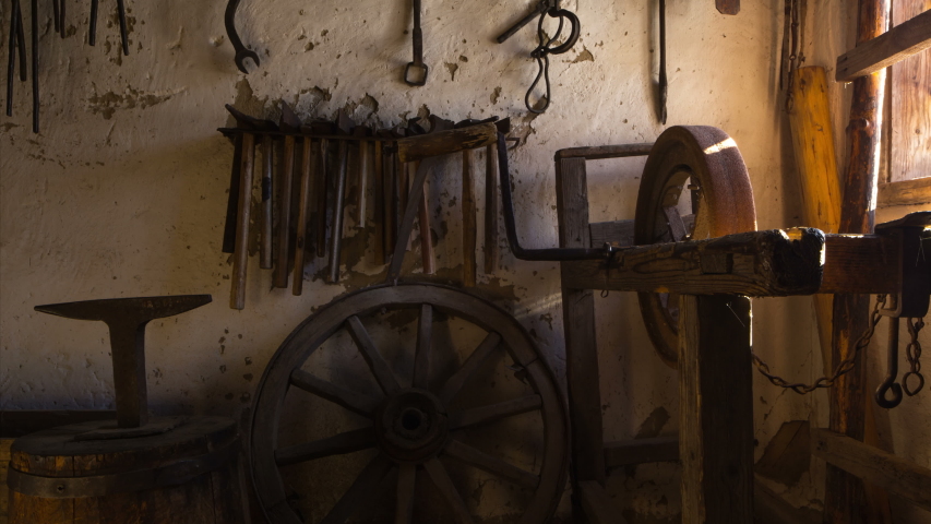 Authentically decorated forge with tools for production of metal products. Motion time lapse. 4K