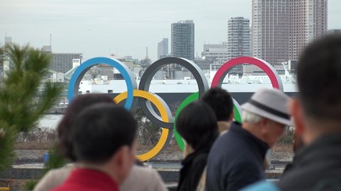 TOKYO, JAPAN - 25 JANUARY 2020 : The five ring symbol of the Olympic Games at Odaiba. Japan will host the Tokyo 2020 summer Olympic and Paralympic. Crowd of people taking photo of the symbol.