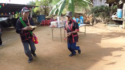 Dancing and blowing musical instruments in the Lahu New Year Festival 8/12/2019 at Rom Klao Song Village, Khirirat Subdistrict, Phop Phra District, Tak Province, Thailand
