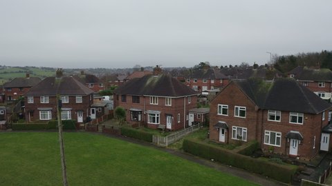 Aerial view, footage of a council housing estate in Kidsgrove Stoke on Trent, flats, homes for the ever growing population, immigration and poorer areas of the west midlands, cheap, affordable housing