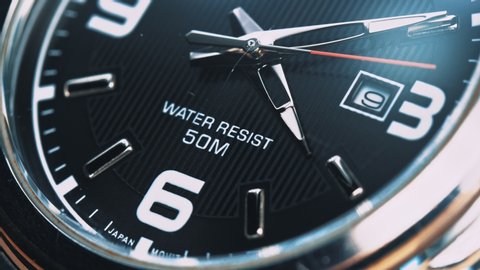 The movement of the hands of a quartz wrist watch. Close up. Business concept and time limit.