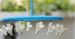 many white plastic clothespins on the clothesline, laundry Concept