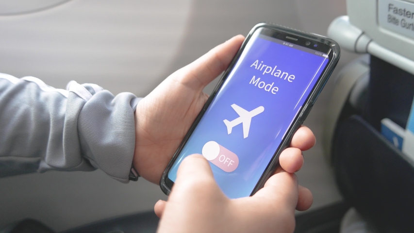 turning-the-airplane-mode-of-stock-footage-video-100-royalty-free