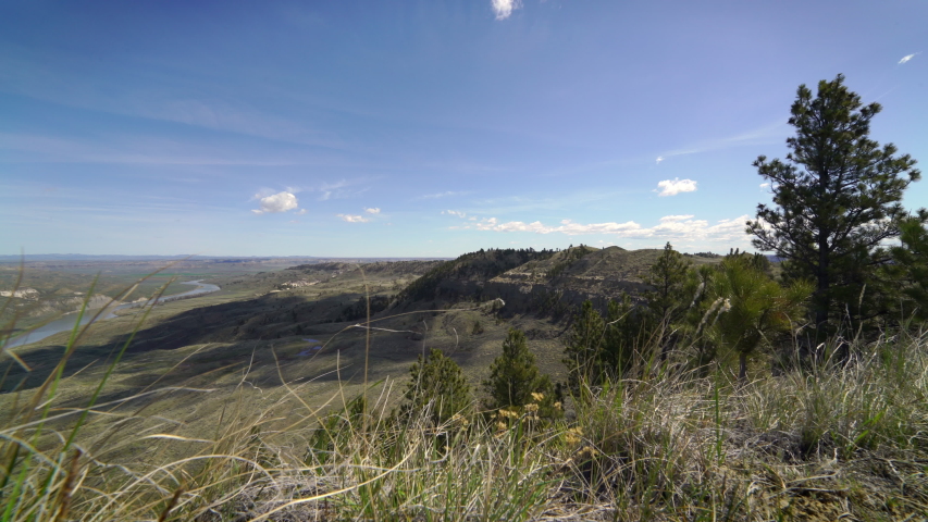 Looking down on the Missouri river in Montana as breeze moves spring grass