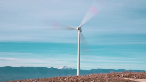 An Italy wind farm or wind park. It is a group of wind turbines used to produce electricity. This particular wind farm is located on the mountains of Italy and it allows to realize "clean energy"